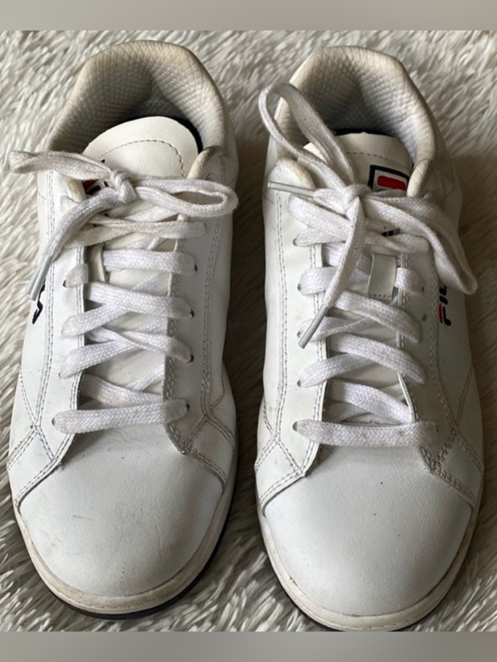 Women’s white sneakers by Fila, size 10